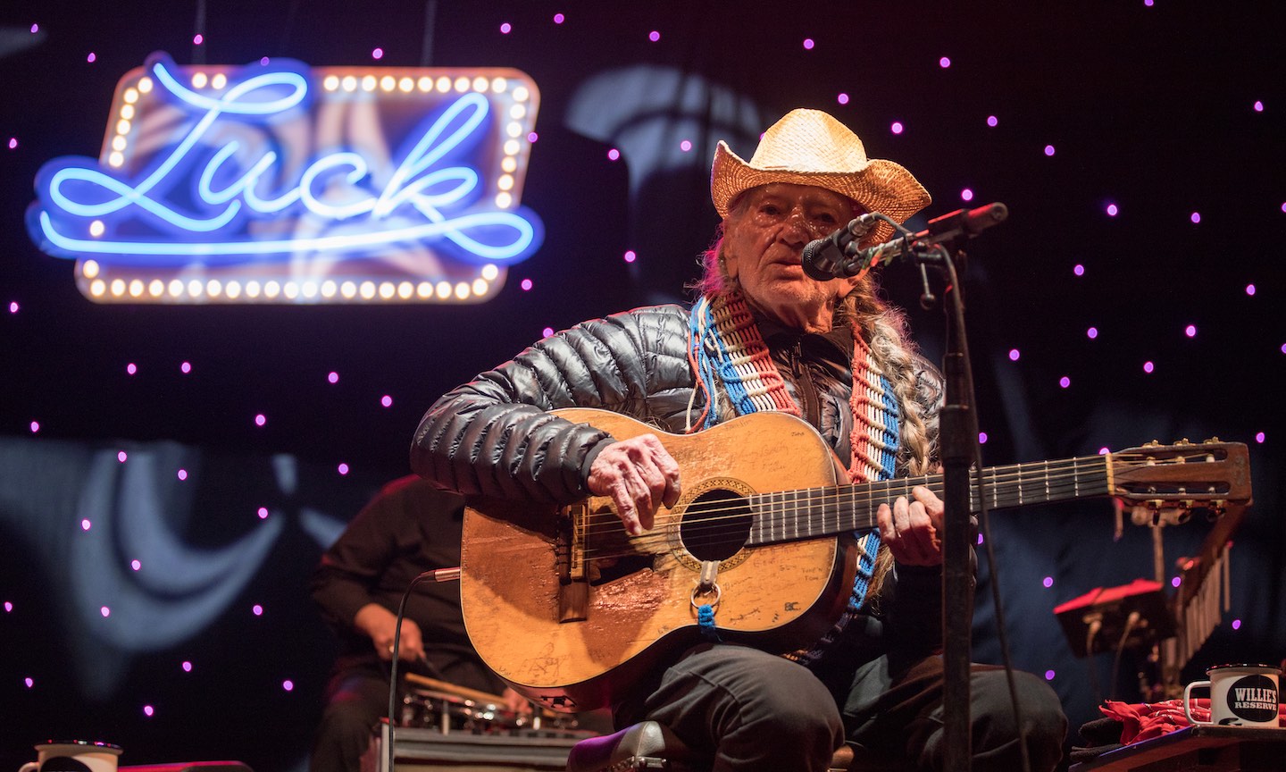 Willie Nelson inhales the love at 90th birthday concert